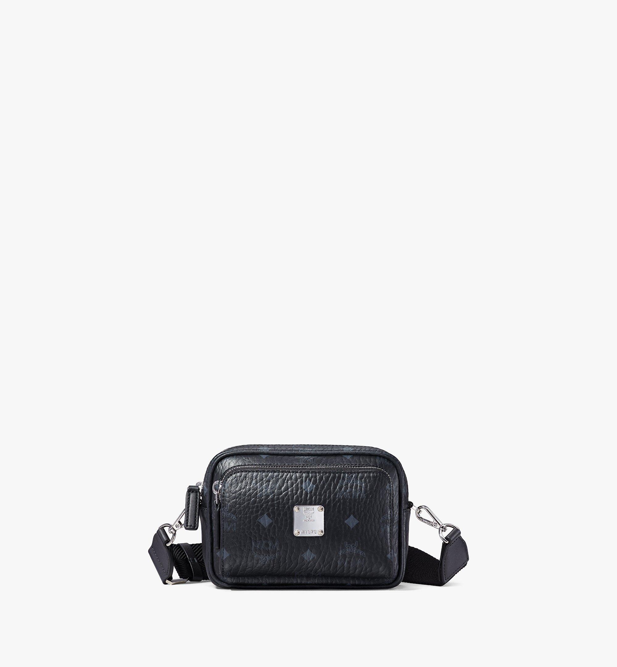 Mcm black sling on sale bag